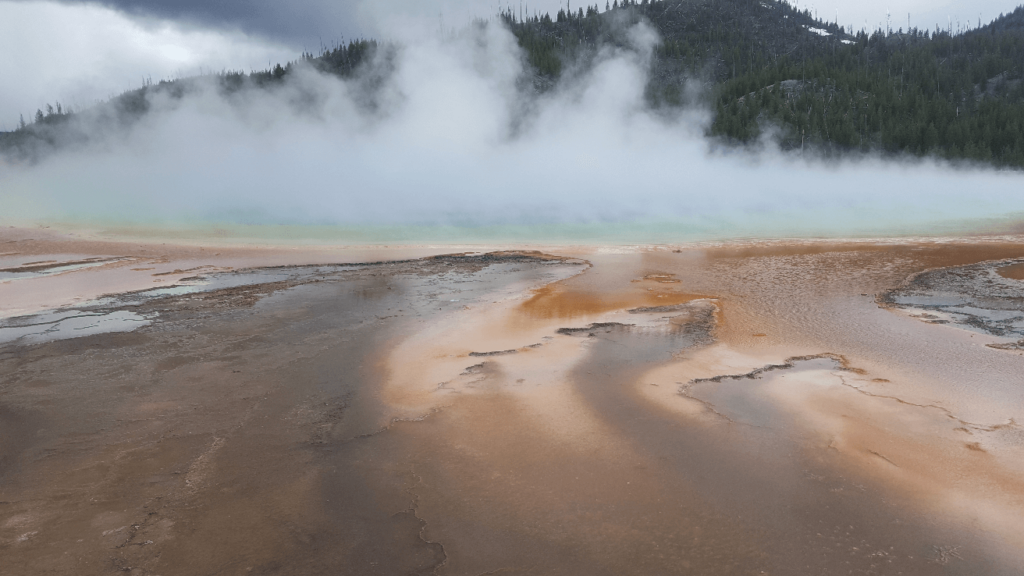 grand prismatic pool with fog over