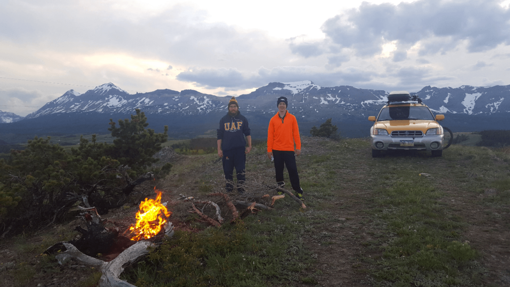 campfire in front of mountains south of glacier national park