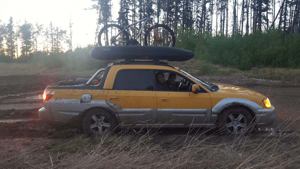 subaru baja in muddy field