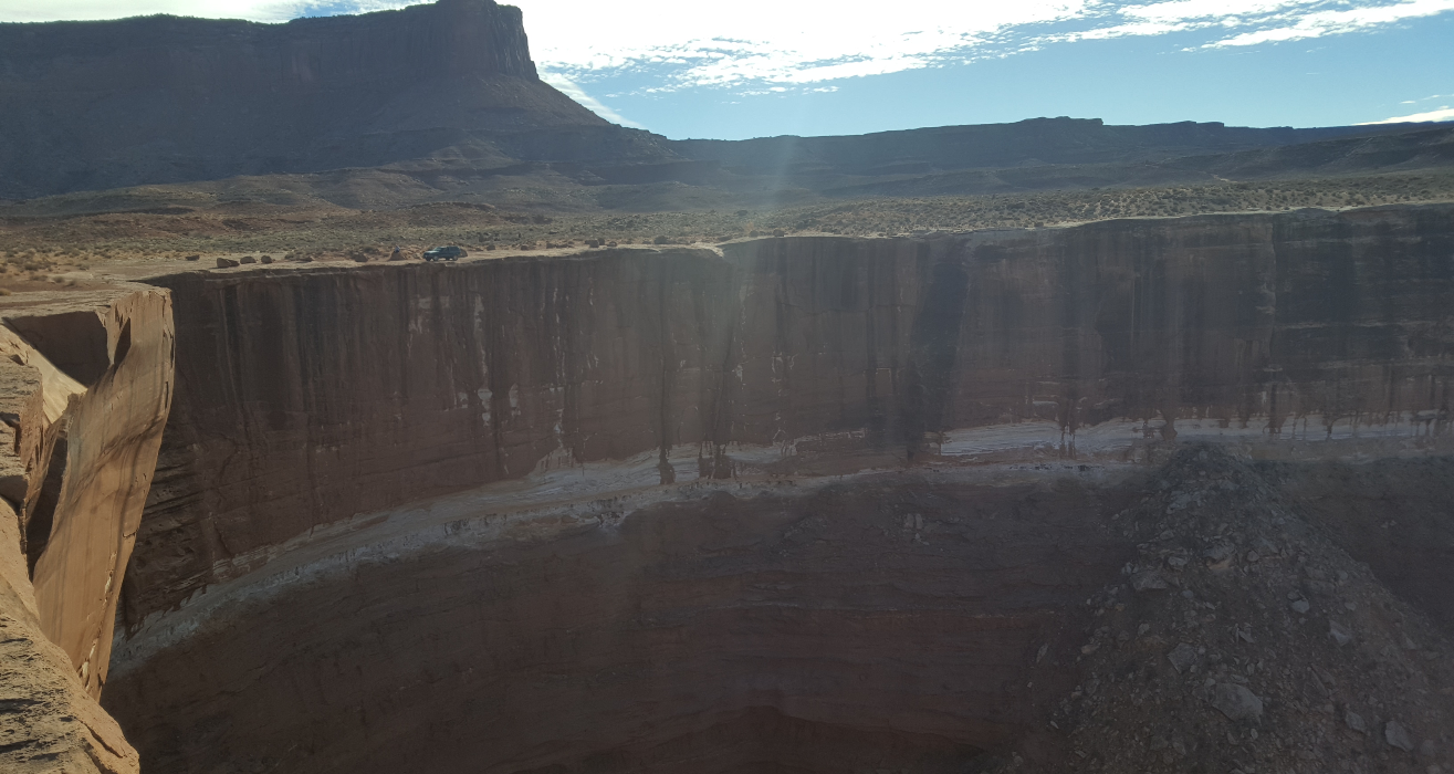 jeep at the top of a huge cliff
