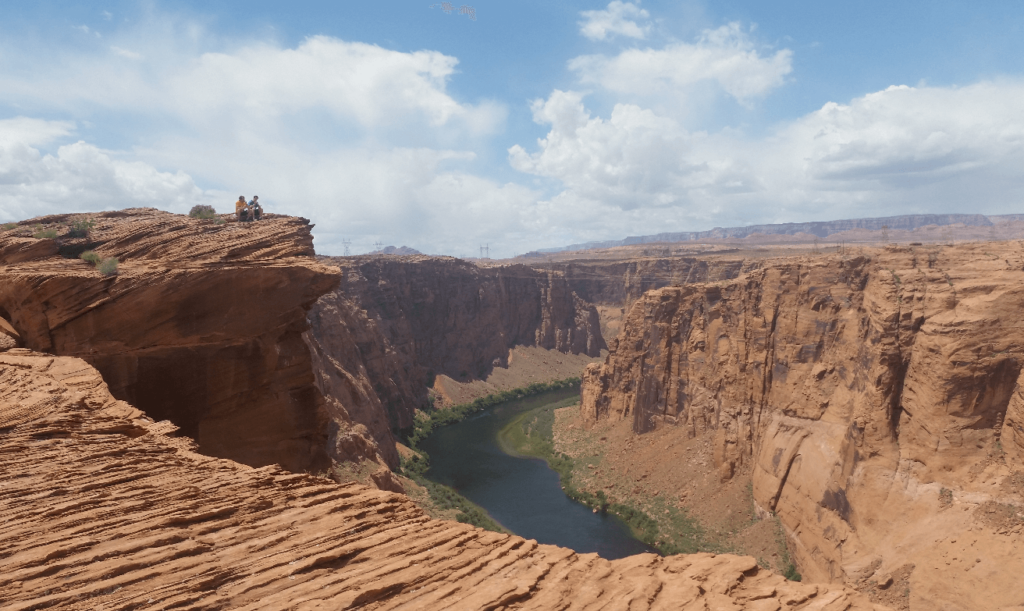 sitting above a red rock canyon with the colorado river below