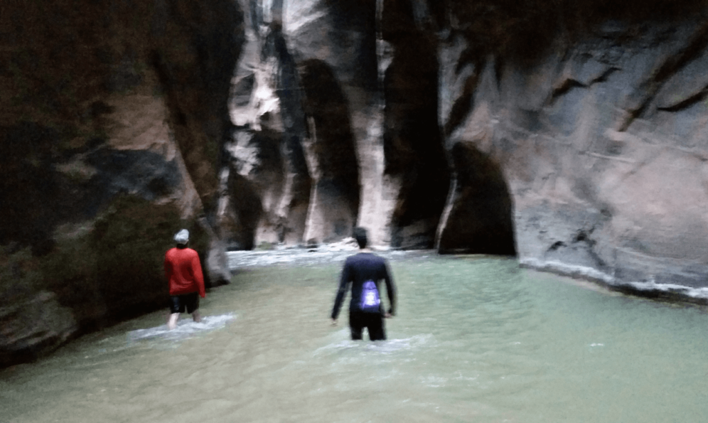 dark canyon with water filling the bottom