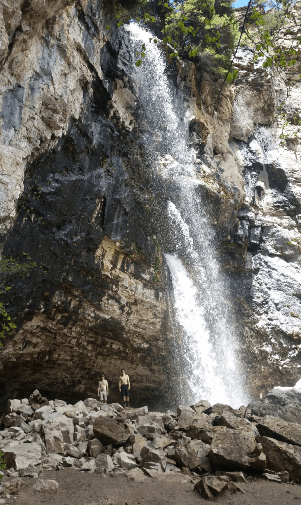 waterfall coming straight out of a cliff
