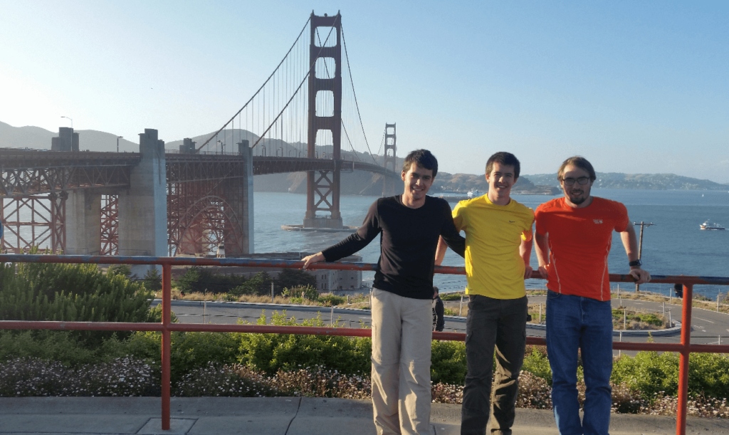 joseph mike and robert standing in front of the south side of the golden gate bridge
