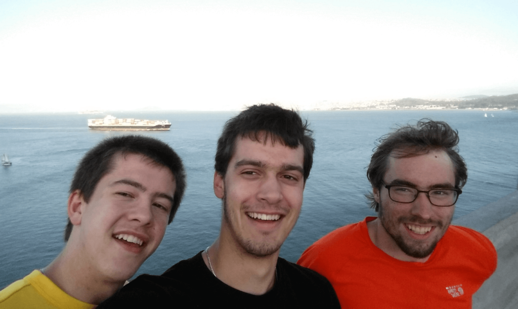 mike robert and joseph halfway across the golden gate bridge looking out over san francisco bay