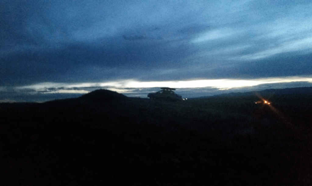 subaru baja climbing a hill at night