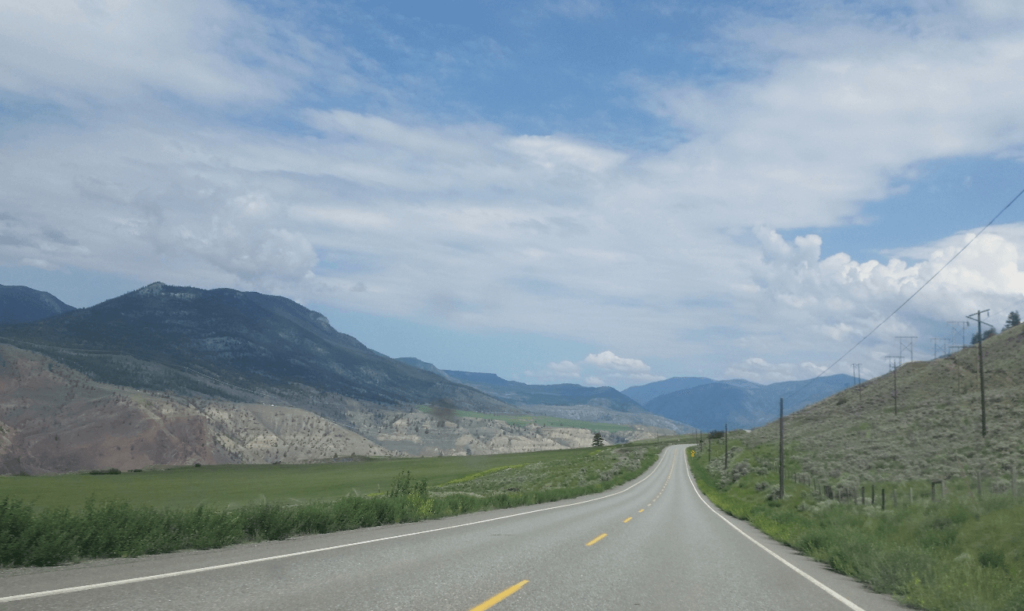 broad canyon with farm fields on sides